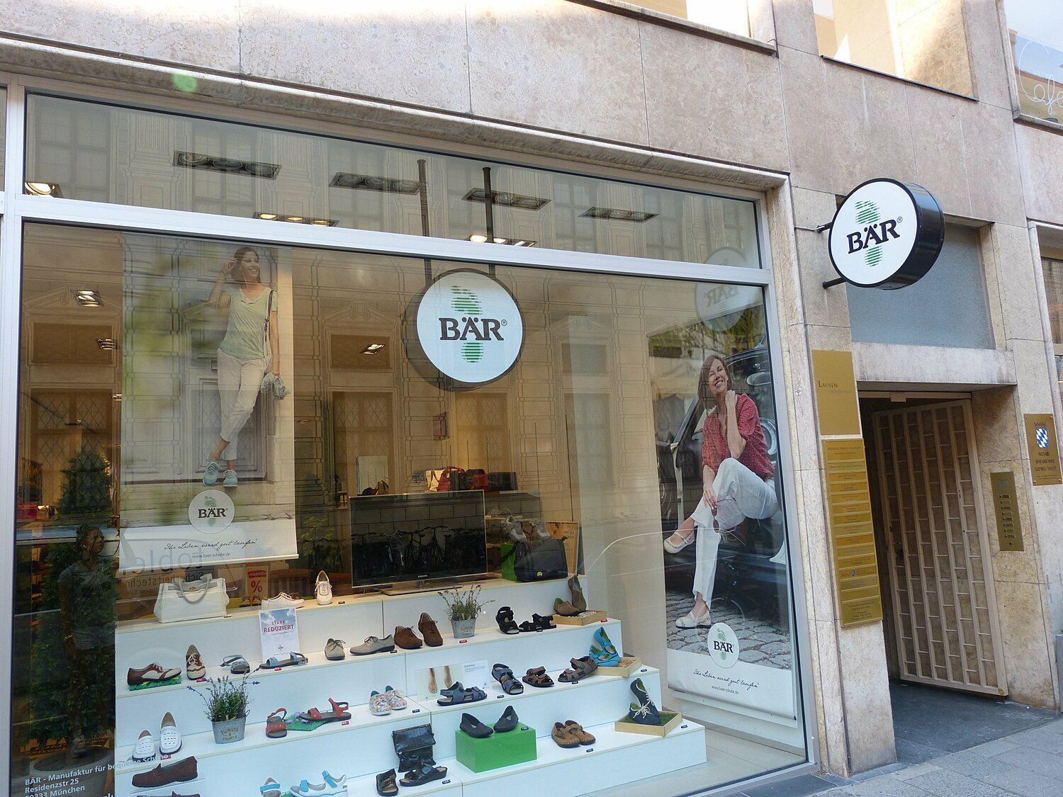 BÄR Shoe Store Front Display with Shoe Collection Front view of BÄR shoe store showing a variety of shoes in the window display.