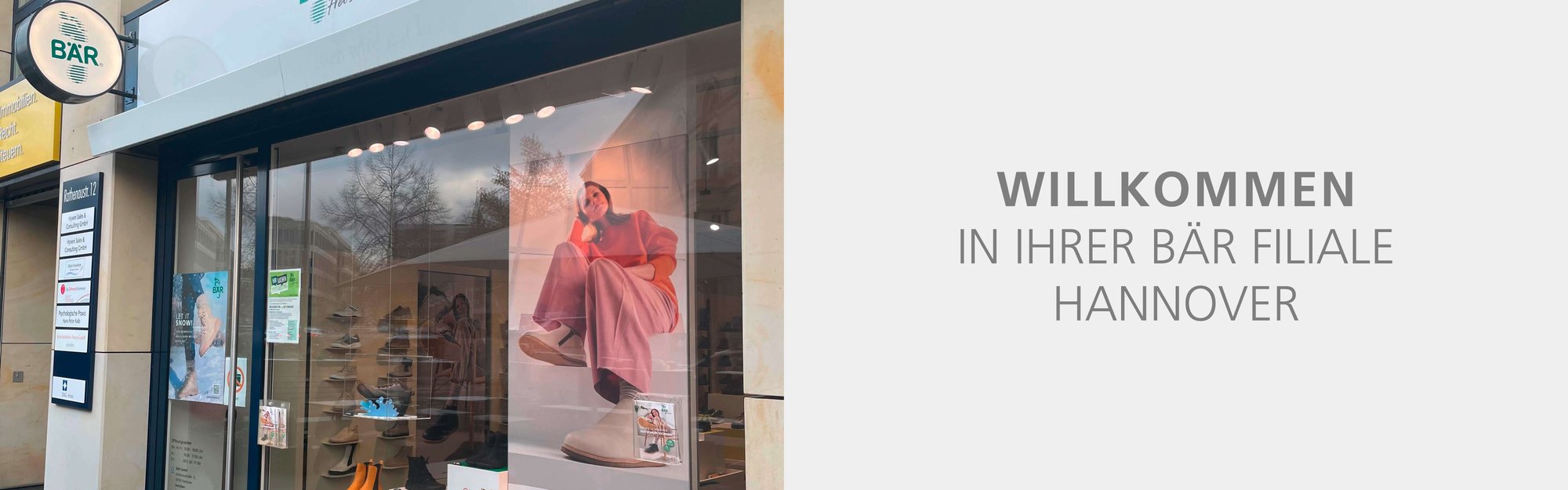 Exterior view of BÄR shoes store in Hannover with welcome sign in German