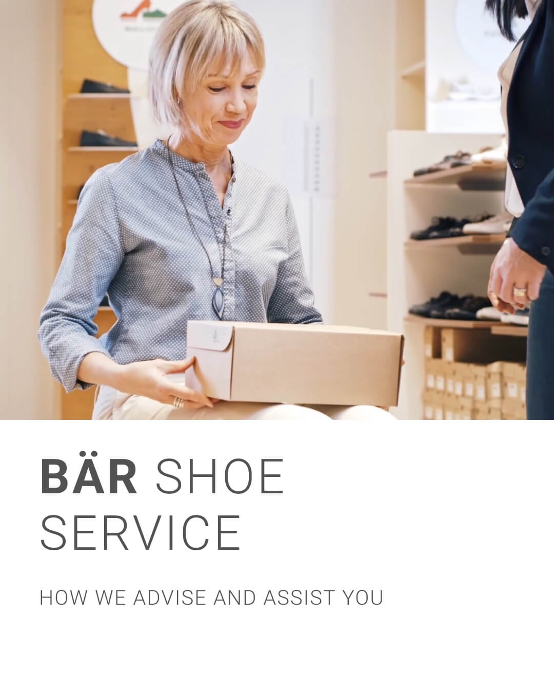 Woman receiving shoe box at BÄR Shoe Service, showcasing customer service.