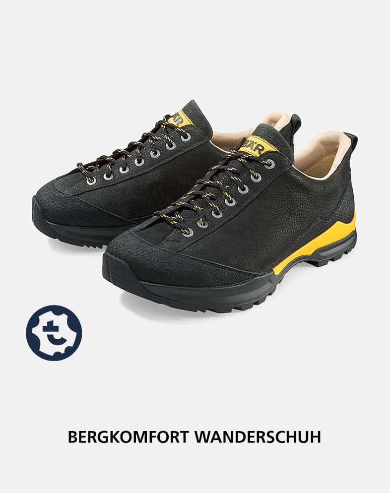 Bergkomfort Wanderschuh - Robuster Outdoor-Schuh für jeden Untergrund Schwarzer Wanderschuh mit gelben Akzenten, ideal für Bergwanderungen. Zeigt die detailreiche Verarbeitung und haltbare Sohle.