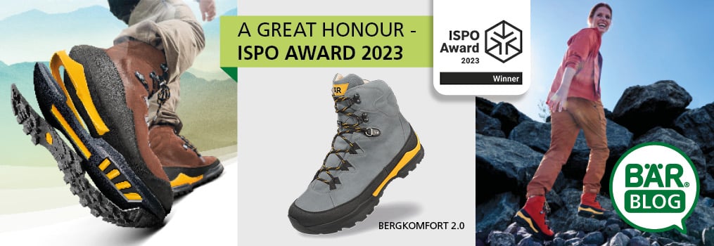 Award-winning Bergkomfort 2.0 Hiking Boots - ISPO Award 2023 Close-up of award-winning Bergkomfort 2.0 hiking boots with ISPO Award 2023 banner