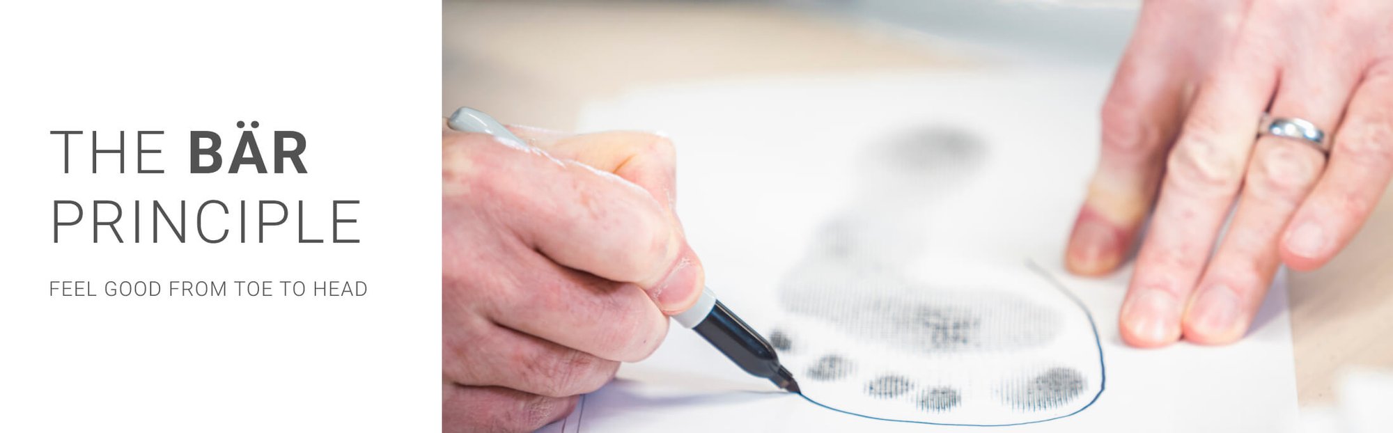 The BÄR Principle - Feel Good from Toe to Head Person tracing a footprint with a pen, representing the BÄR Principle of comfort from toe to head.