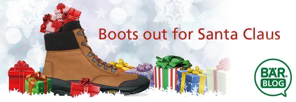 Holiday Boots and Gifts with 'Boots out for Santa Claus' Message A pair of brown boots surrounded by colorful wrapped gifts and the text 'Boots out for Santa Claus'.
