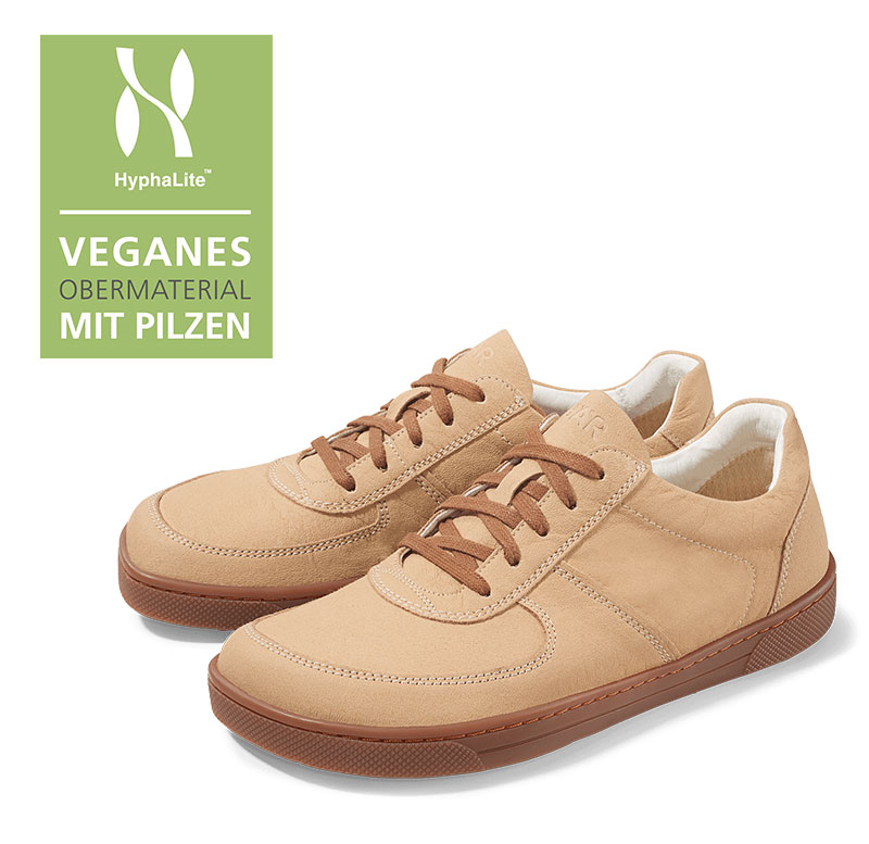 Vegan Sneakers with Mushroom-Based Material Pair of vegan sneakers in light brown with a mushroom-based upper material.