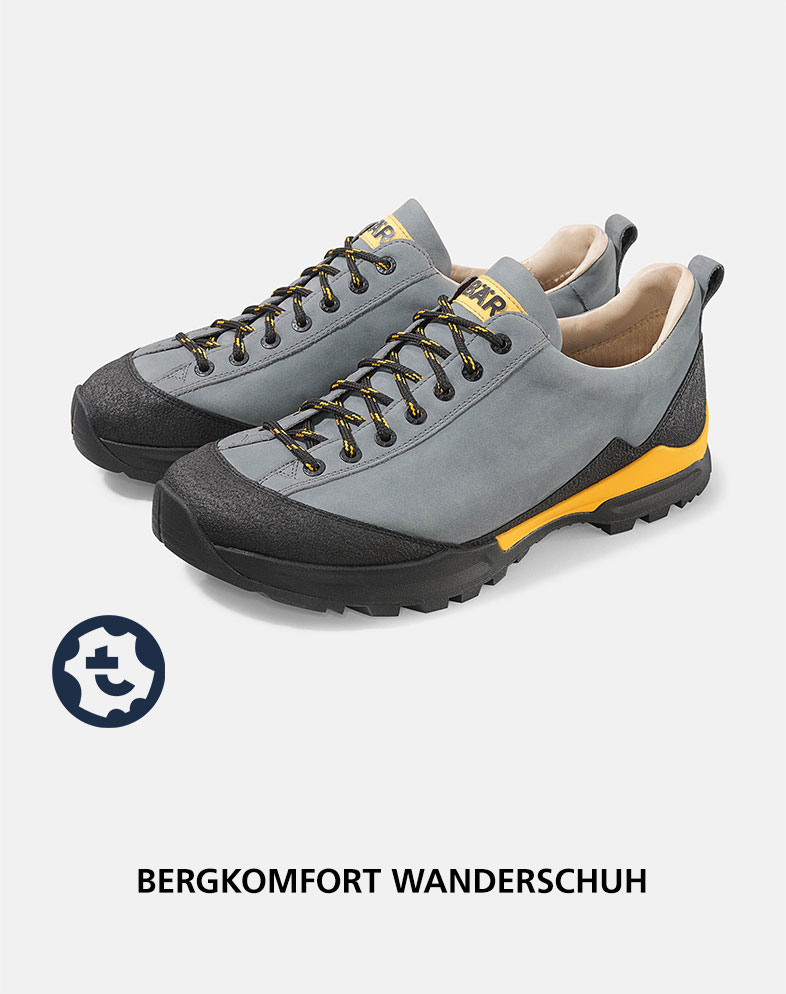 Grauer Wanderschuh mit gelben Akzenten und robuster Sohle, ideal für Bergwanderungen