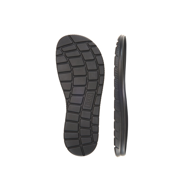 Unterseite und Seitenansicht einer schwarzen Schuhsohle Schwarze Schuhsohle in Unteransicht und Seitenansicht