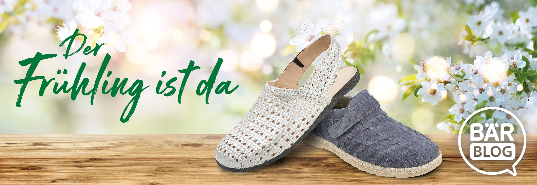 Spring is Here – BÄR Blog Highlights Spring Footwear Collection Woven spring shoes on a wooden surface with blooming flowers and text 'Spring is Here' in the background, promoting BÄR Blog.