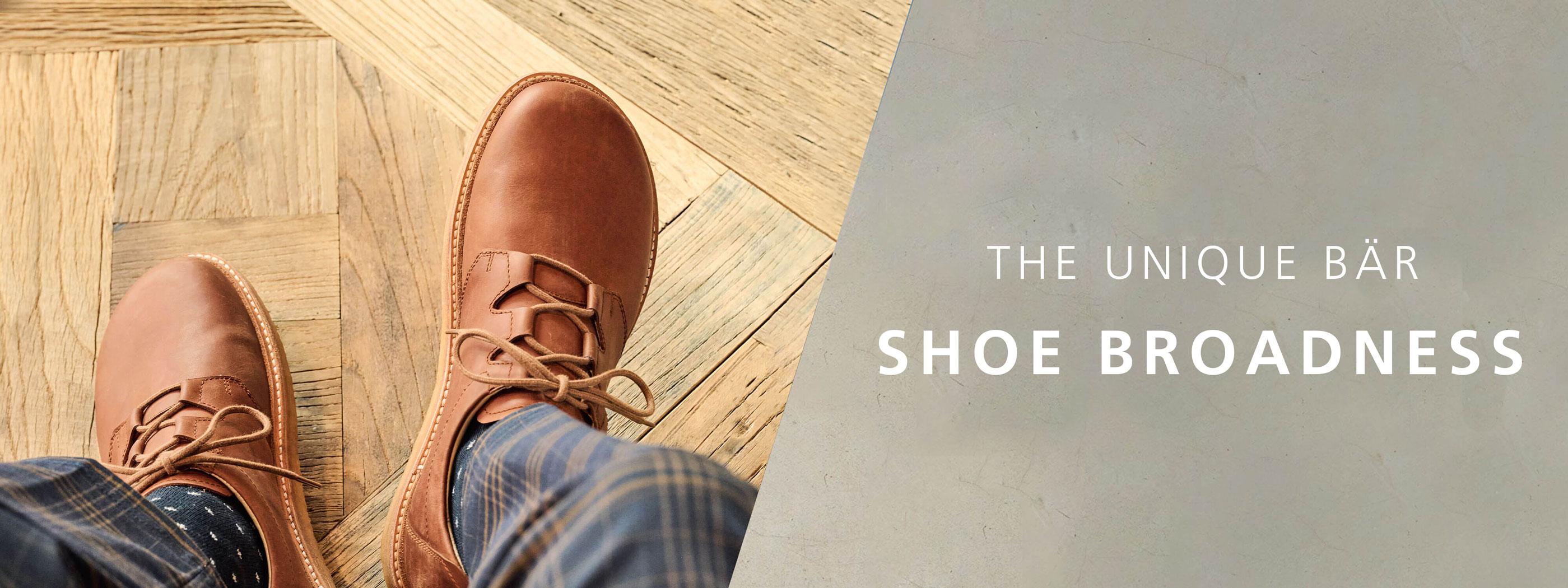 Comfortable brown leather shoes on patterned floor showcasing unique BÄR shoe broadness Person wearing brown leather shoes on a wooden patterned floor with focus on BÄR shoe's broad design and comfort